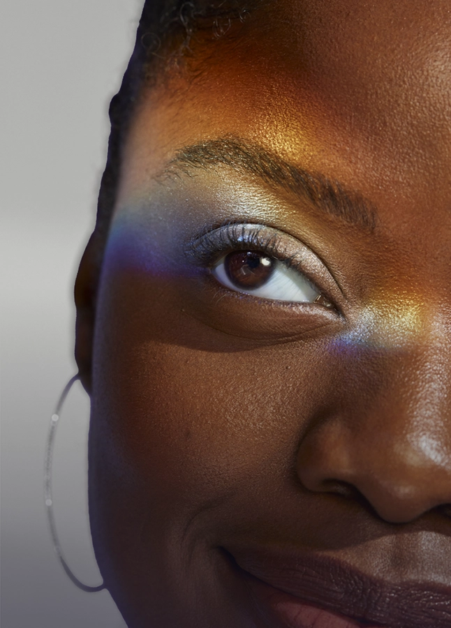 Woman holding Lumify redness reliever eye drops